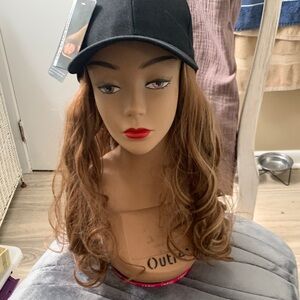 Black Baseball Cap with sewn in Brown Wig with highlights.